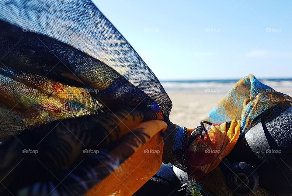 a Shawl on the baby's stroller by the sea