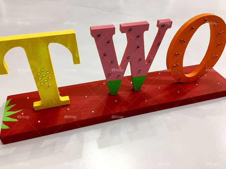 Letters spelling two and decorated like fruit