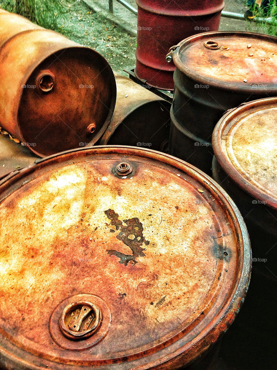 Collection of old rusty oil barrels