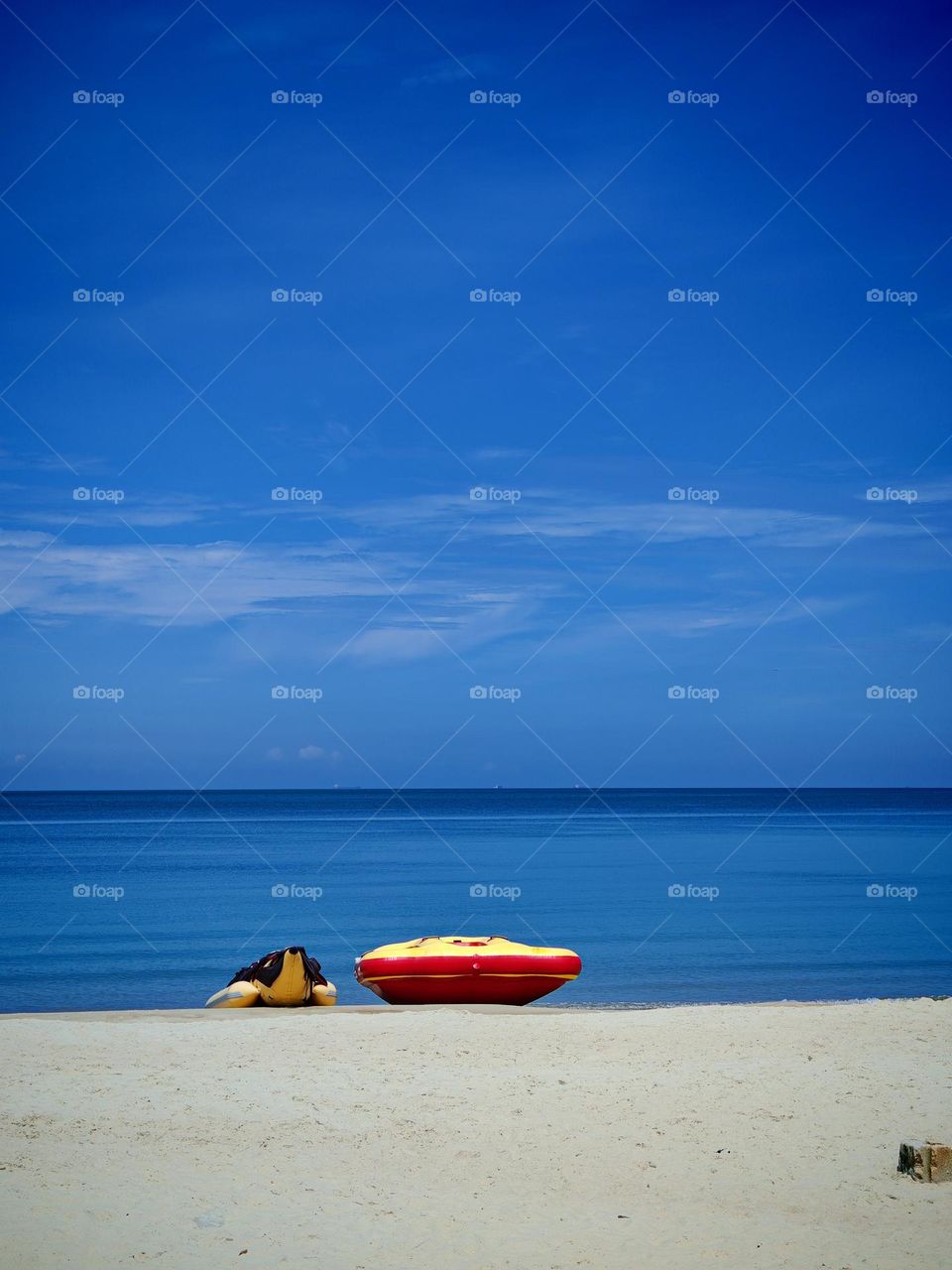 Banana boat on the seashore with beautiful view of the blue ocean and sky