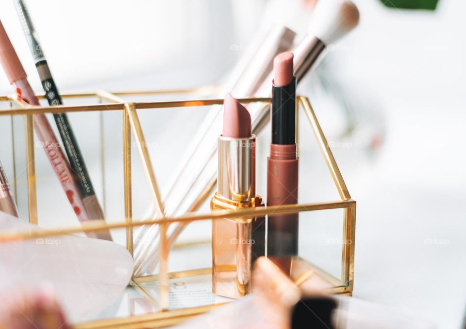 Makeup products on window sill