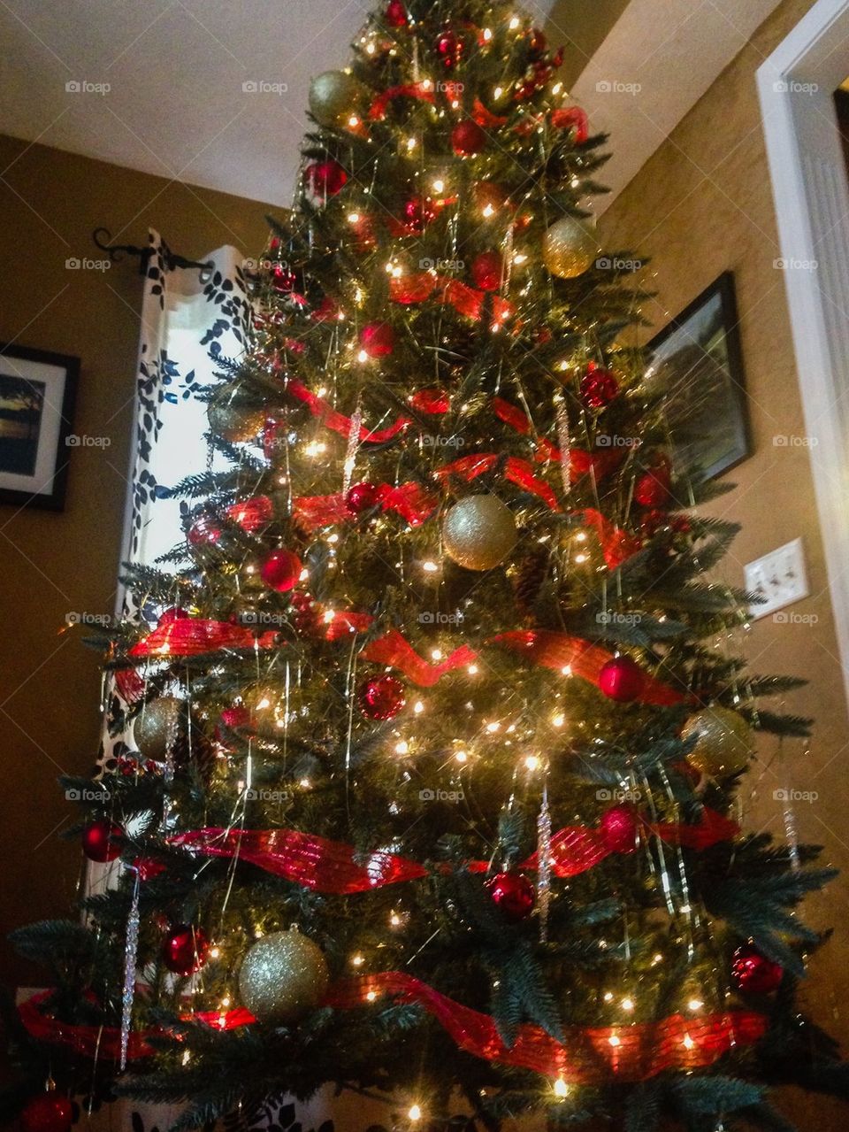 Red and gold Christmas tree with lights