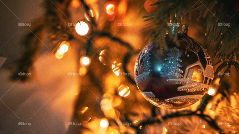 Ornament in the chaotic colorful Christmas tree.