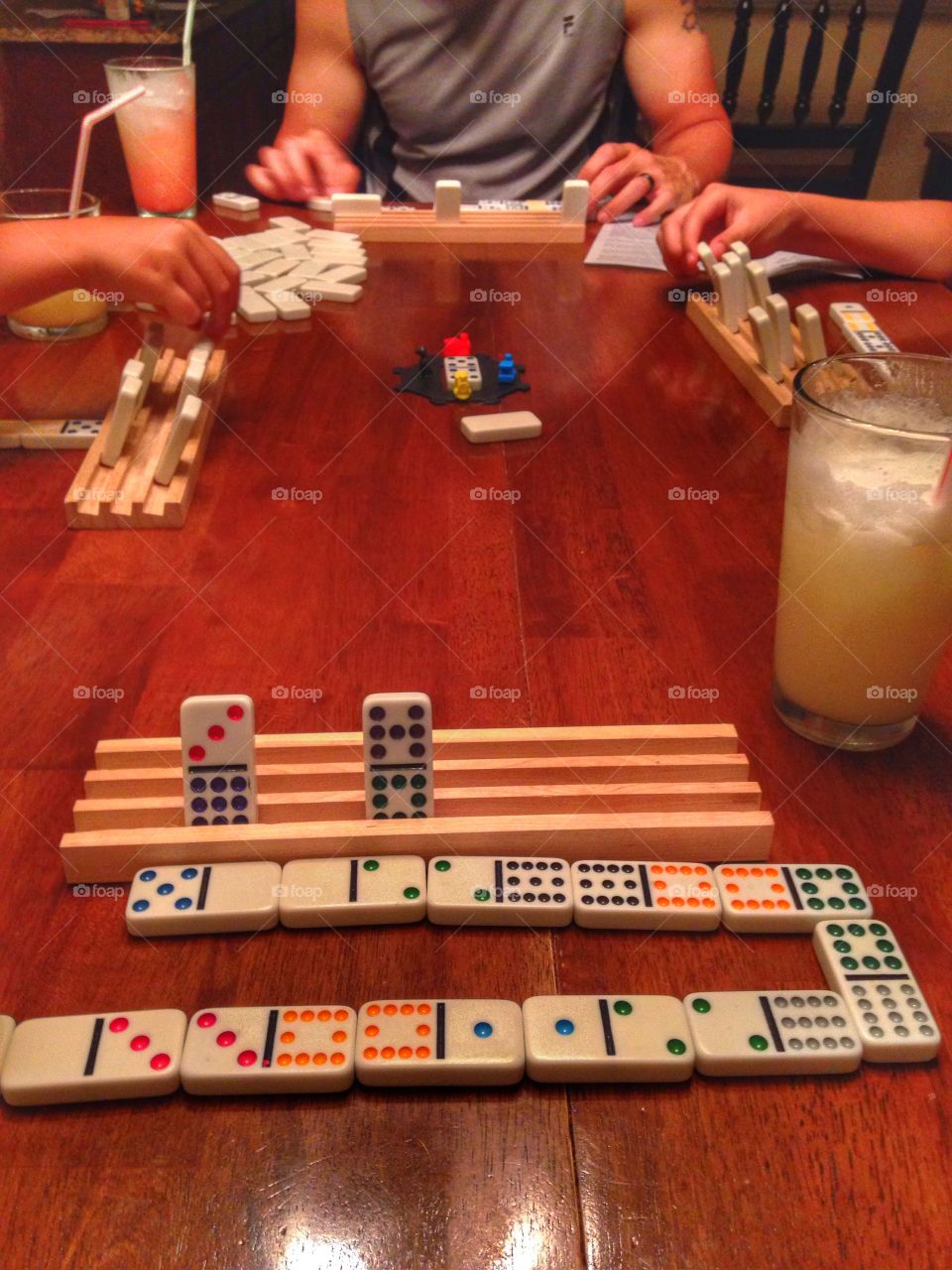 Family game night . Family playing a game of Mexican train