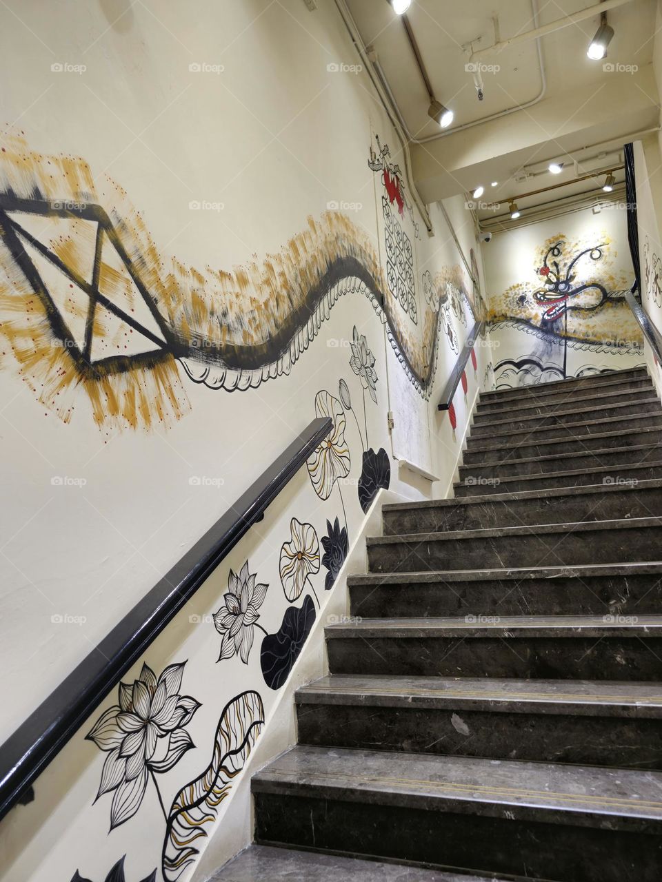 Staircase with wall art of a dragon