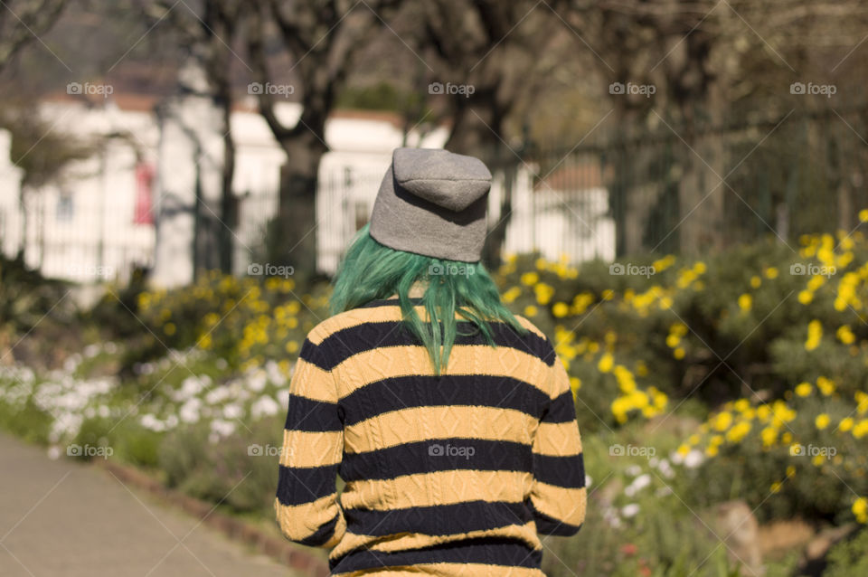 Alternative girl with green hair walking