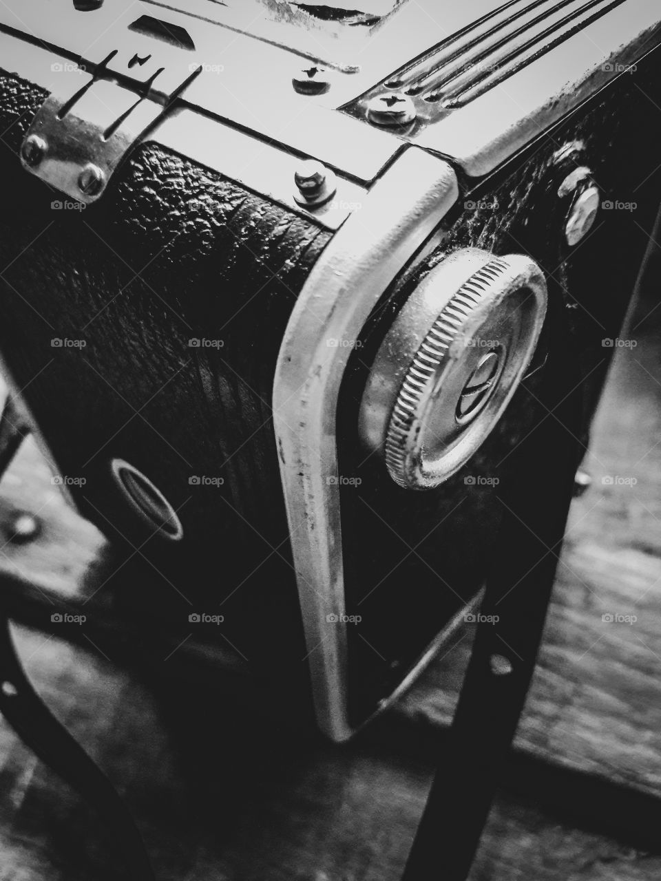 Vintage style black and white photograph of an old Kodak Duaflex Camera.