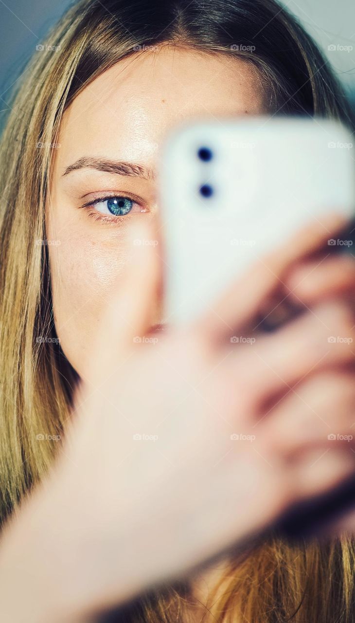 Portrait of girl content creator wit her phone