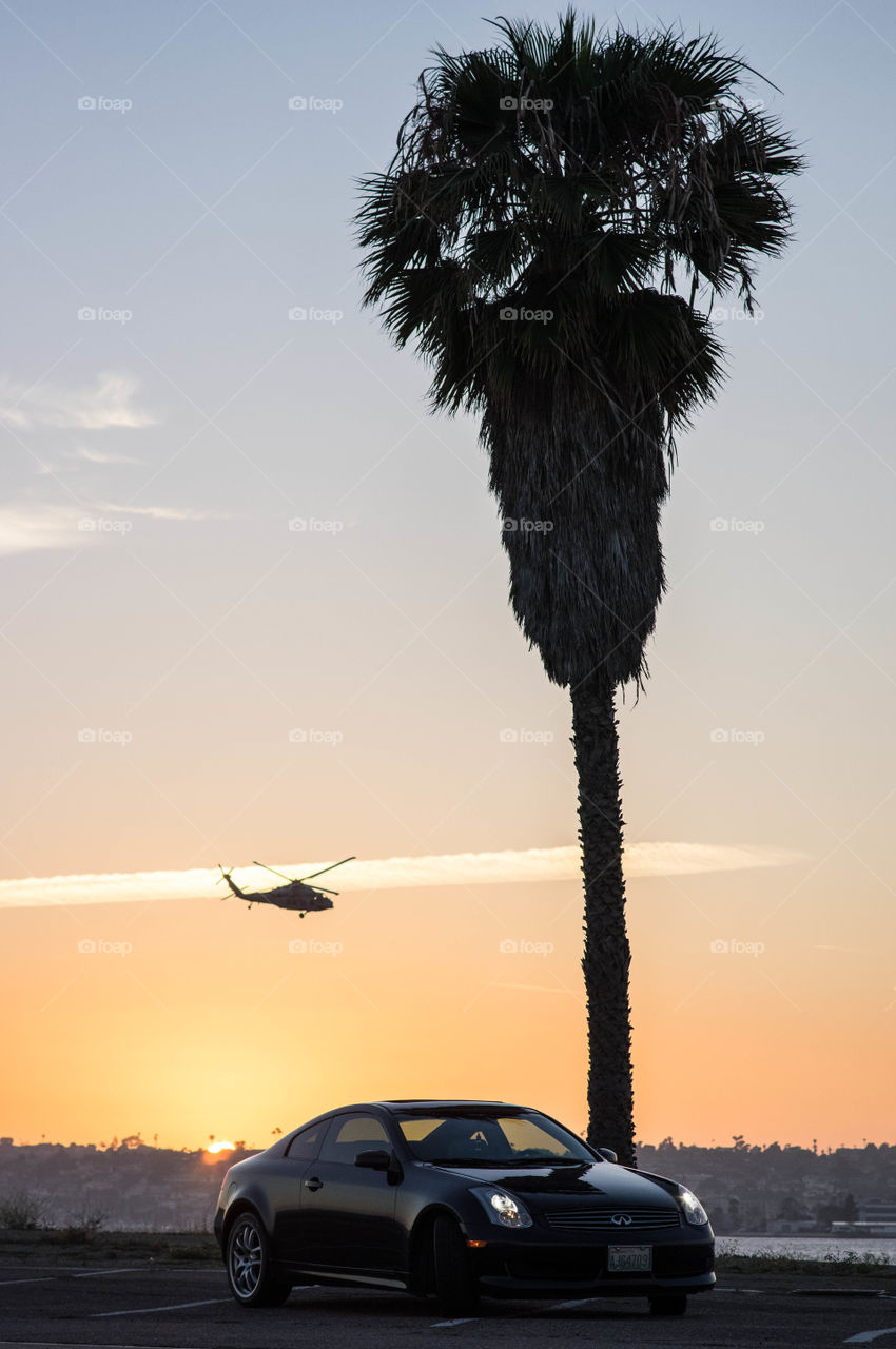 Drive by. Helo/car sunset