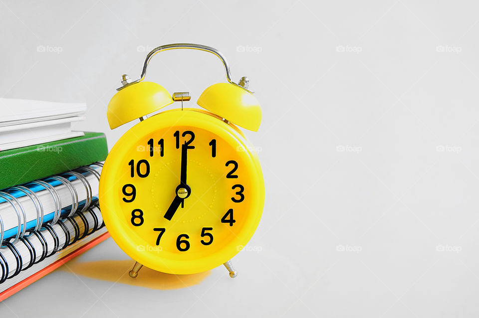 Alarm clock isolated on gray background with copy space 