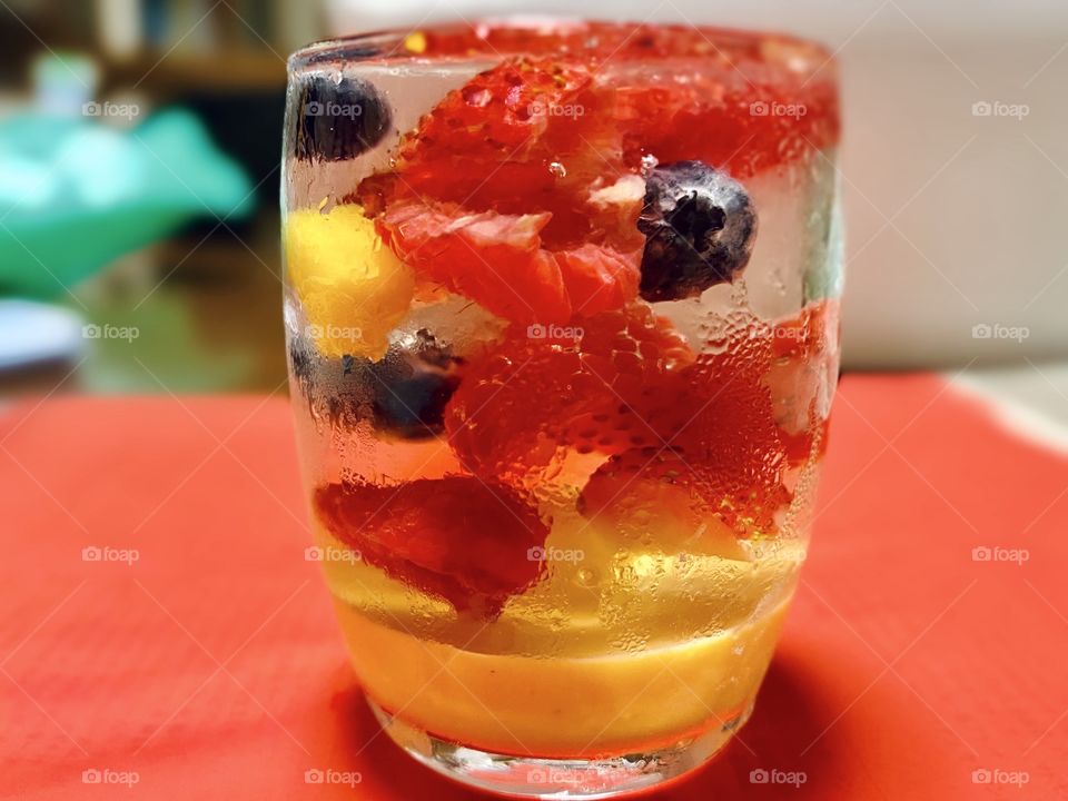 Red desert, strawberries, blueberries and mangoes 