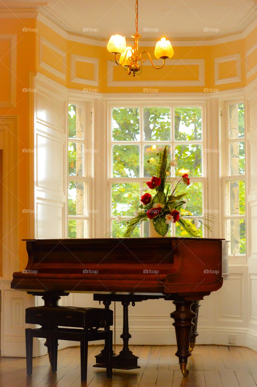 Flower vase on piano