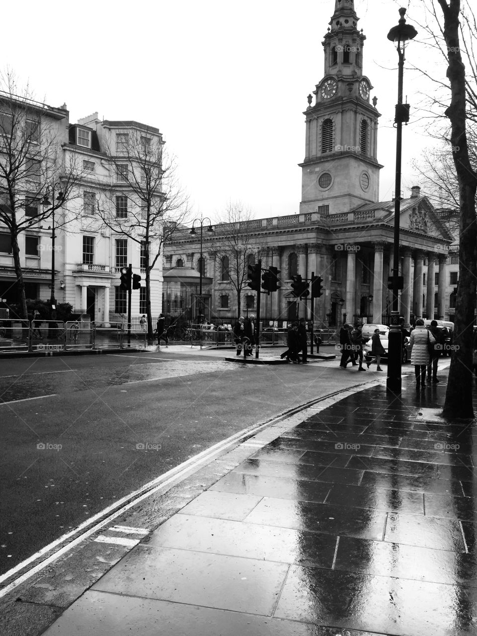 A monochrome capture of typical English weather- heavy rain. Captures the reality of London, with the hustle and bustle, along with the striking architecture. 