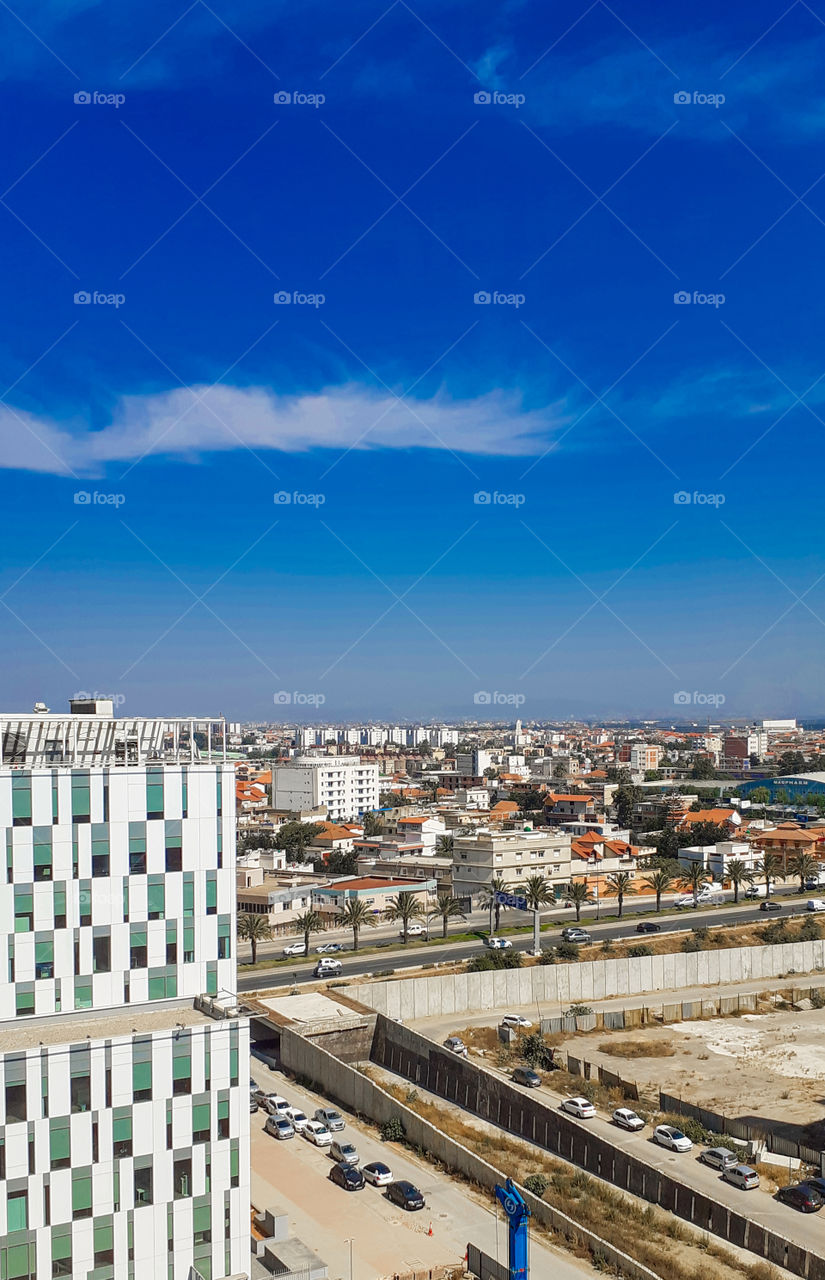 buildings throw blue sky in Dar Elbeida town in Algiers