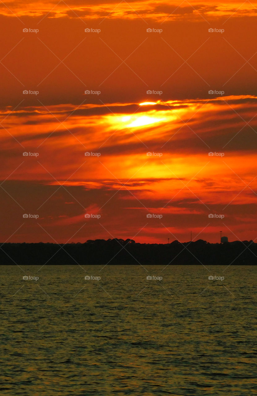 The sky was filled with the most brilliant orange complimented perfectly with hues of gold, yellow, red and crimson. An orange haze had casted over the water, reflecting off every wave. Finally,the sun disappears along with the shine. I can only wait to see another magical moment of beauty and warmth! I can only wait for another sunset! Enjoy!