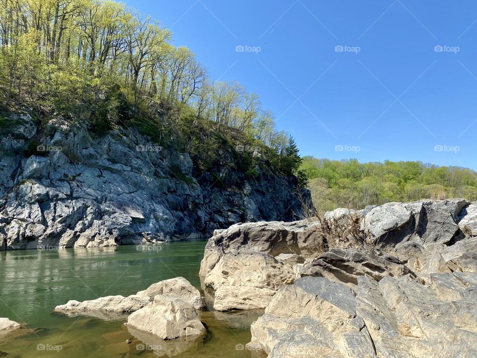 A river flowing past rocky cliffs 