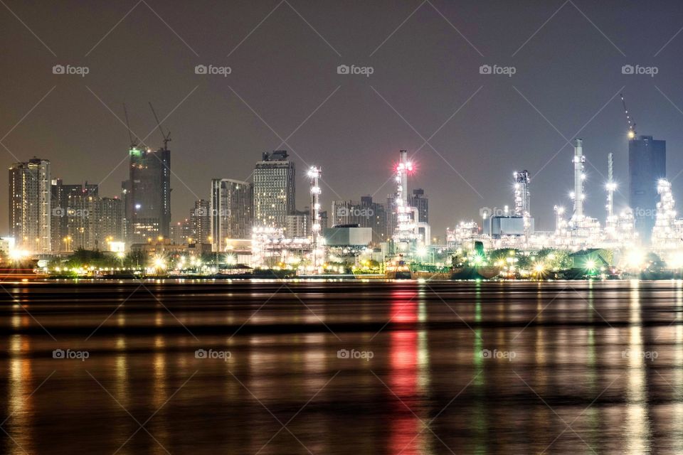 Light of city reflect on Chao Phraya River in Bangkok Thailand