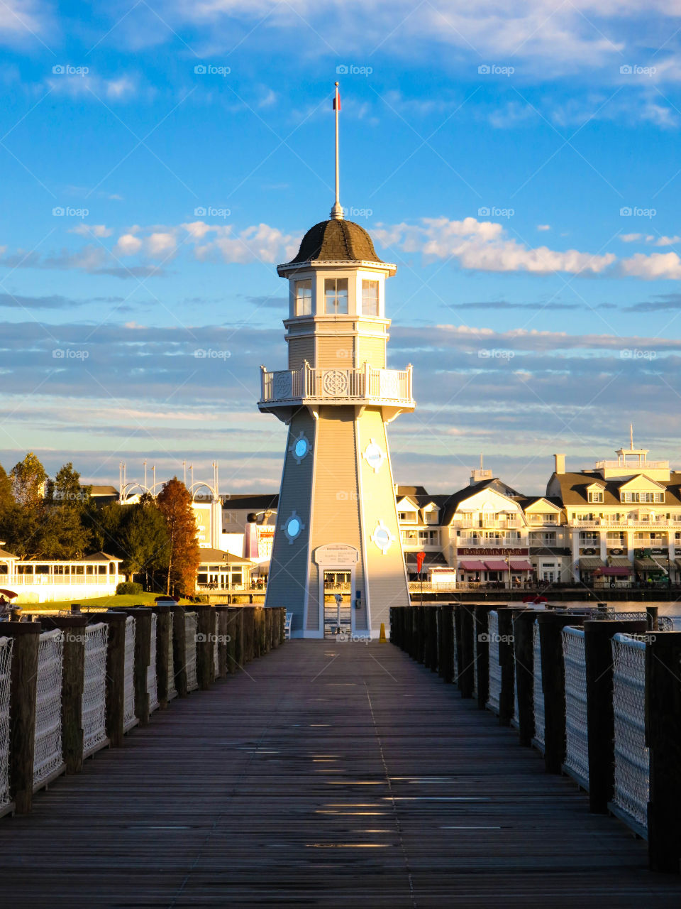 Light Will Lead You Home. Lighthouse on a pier at the Beach Club Resort at Disney World in Orlando, Florida.