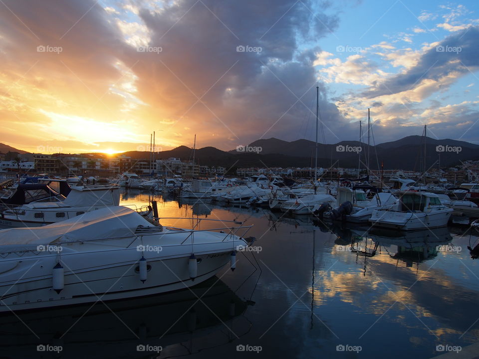 Reflection of clouds in the sea of ​​the port of llança