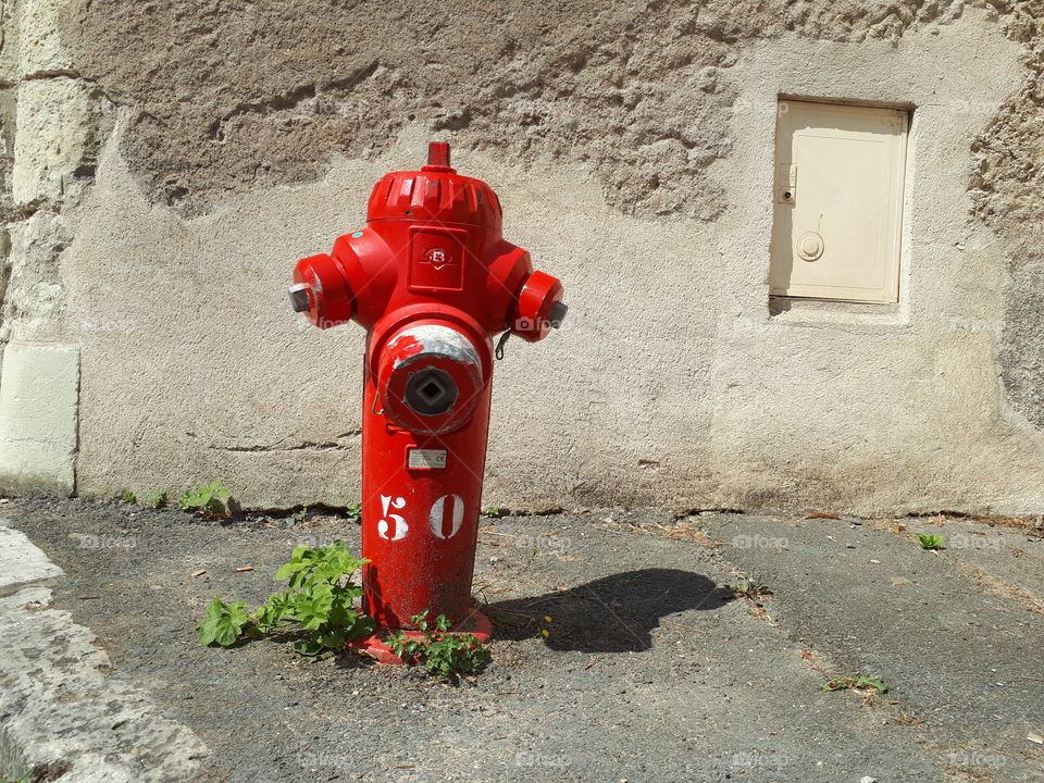 Red tap water at the street