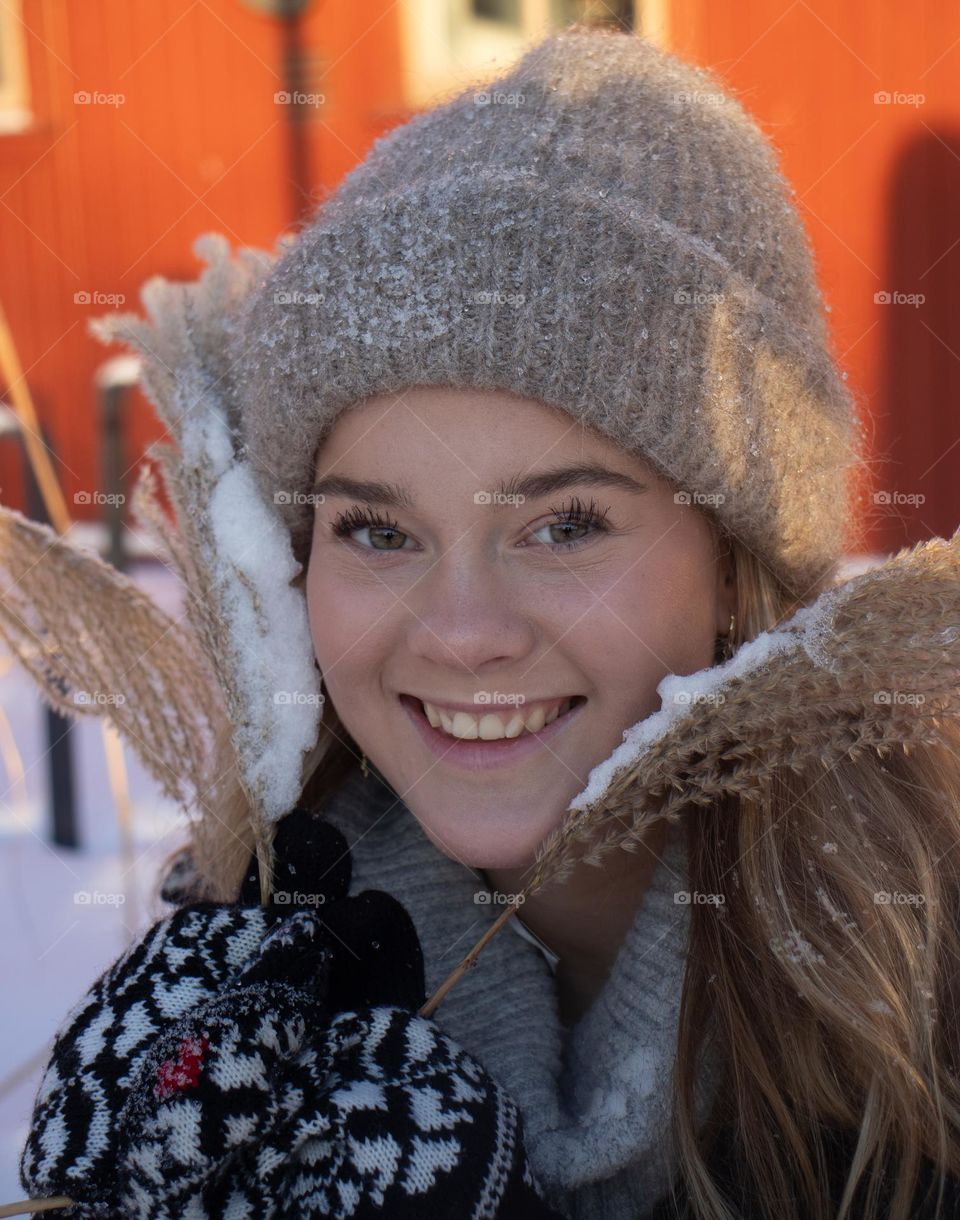 Winter young grown up. Playing in the snow . In norway . happy face . 
winterwonderland.  cold day.