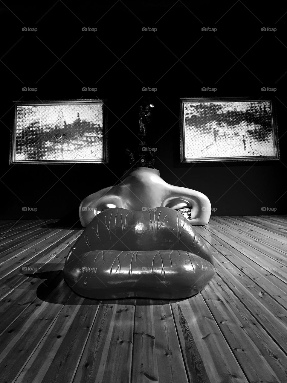 Black and white shot of Salvador Dali's Saliva Sofa creation exposed in his theater museum in Figueras, Spain