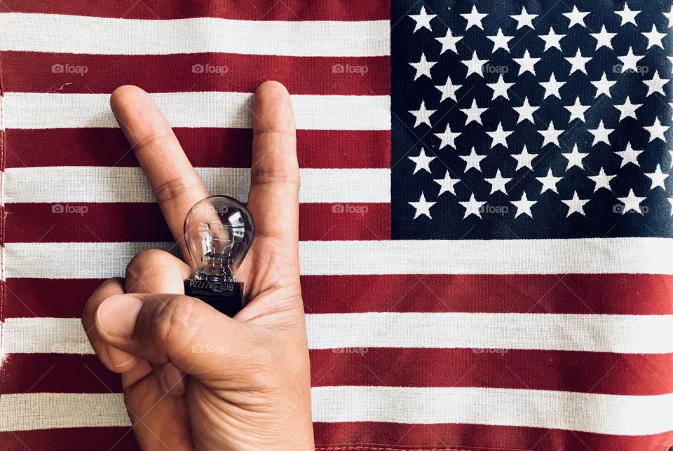 Flag, bulb and hand sign 
