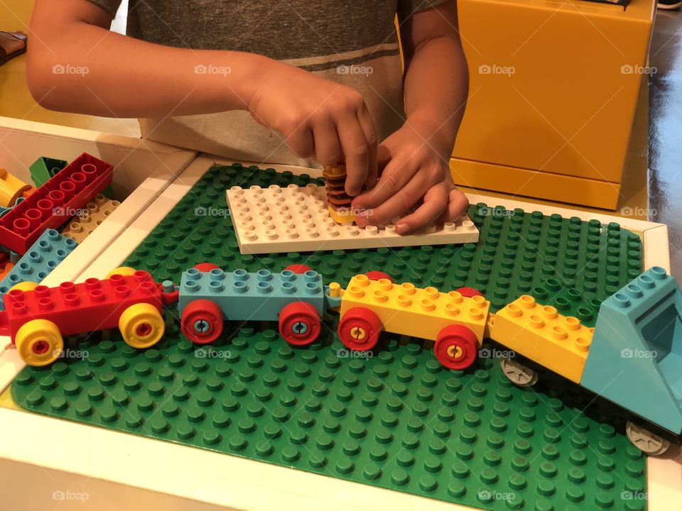 Boy playing with lego blocks 
