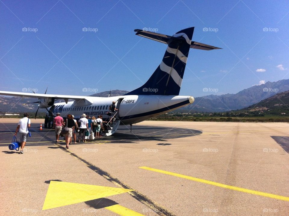 Passengers boarding airplane