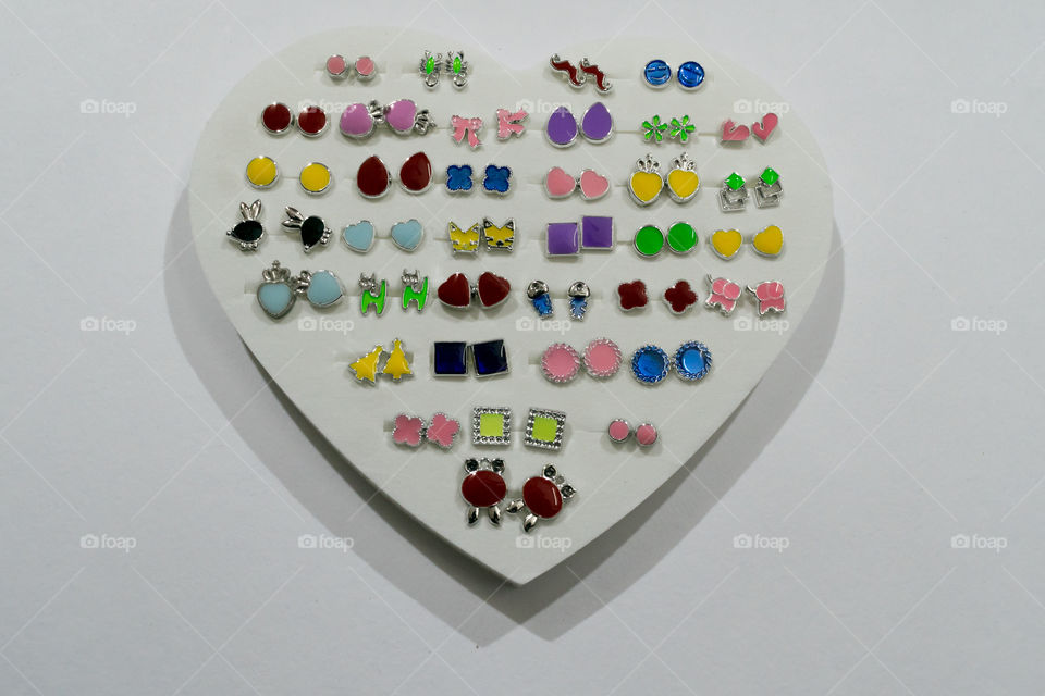 Homemade Indian Artificial designer "Maang Tikka" or "Bindi" collection. Multi colored Fashion Jewelery or Easy Crafts on isolated white background.