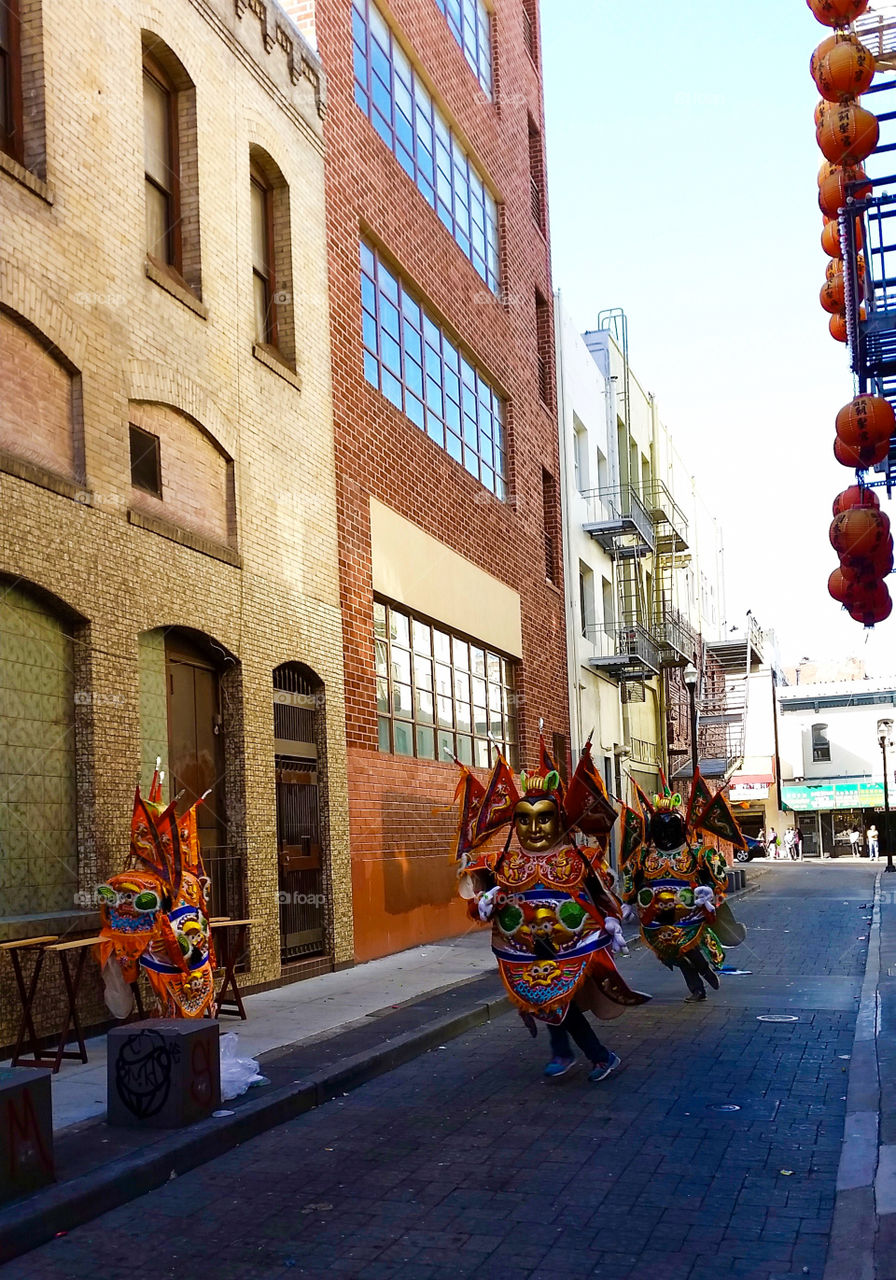 Men in mask. Men in mask dancing in Chinatown, San Francisco