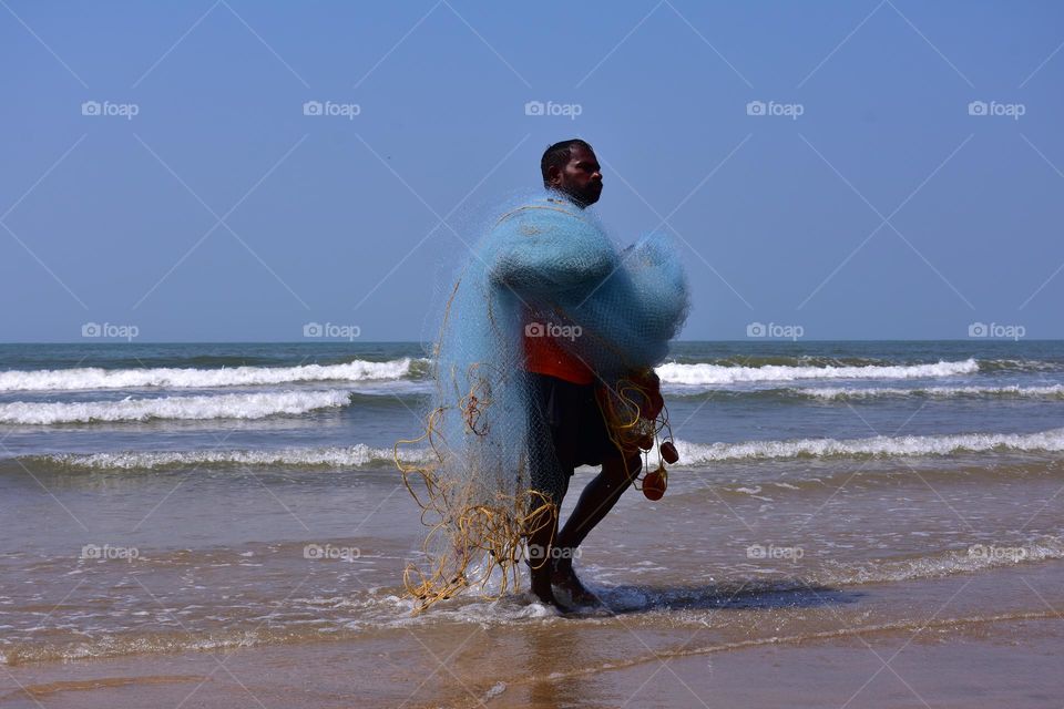 Fisherman at the sea