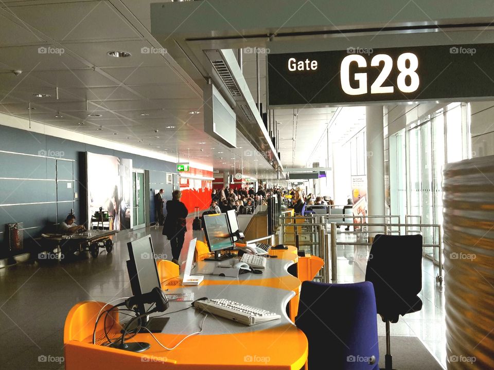 at the airport. waiting at the gate for boarding