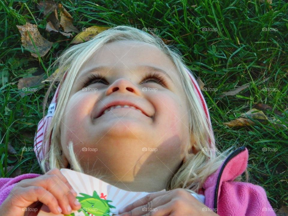 Girl laying down in the park