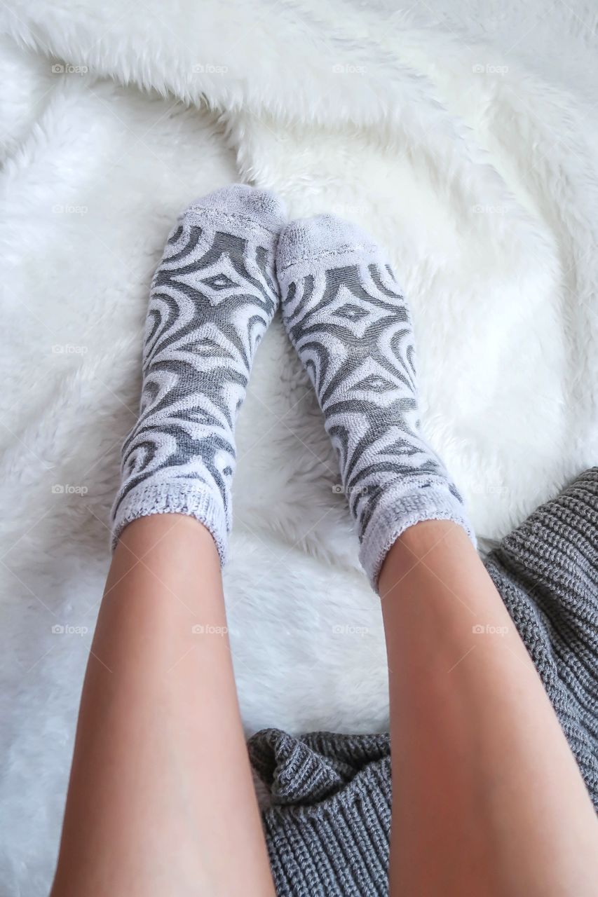 Woman's legs in warm socks 