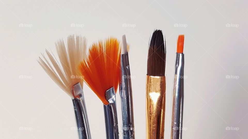 Paintbrushes against white background