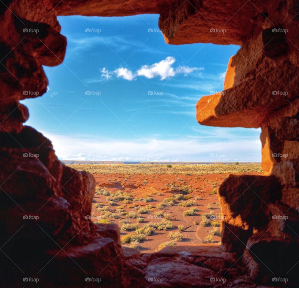 Looking at the window of a pueblo ruin in Arizona