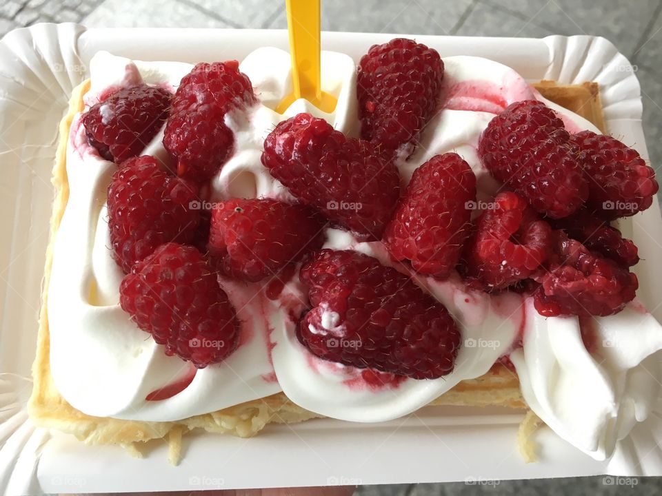 Raspberries and whipped cream on Waffle in Poland!