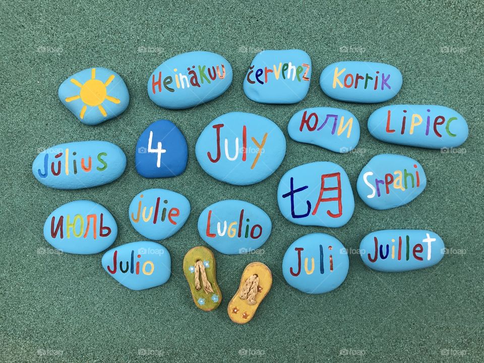4 July, calendar date with colored stones in many languages