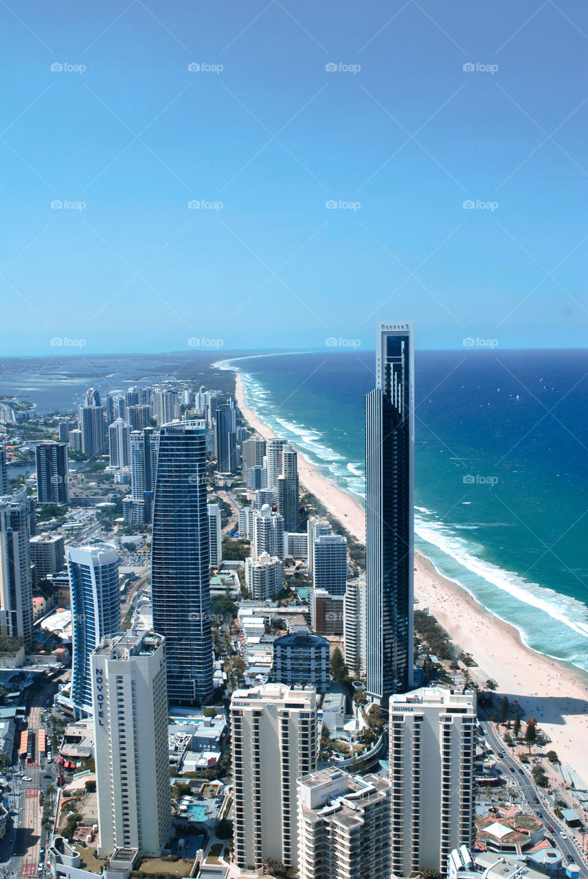 Surfers Paradise, a Queensland beach next to skyscrapers.