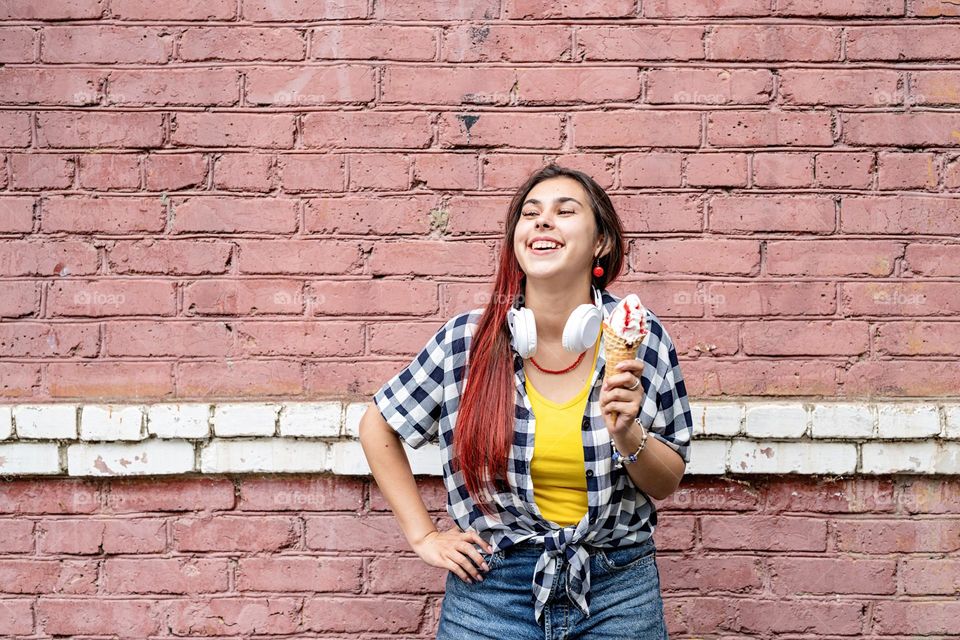 woman against pink wall