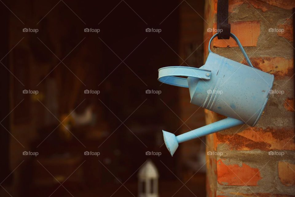 Blue watering can