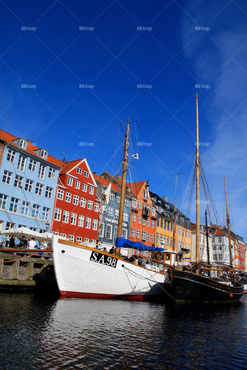Niehaven Copenhagen Denmark canal on a sunny day sailing ship dock