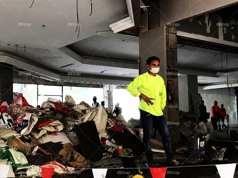 Try to guess what was he thinking, may be like "what should I do for all trashes behind me"