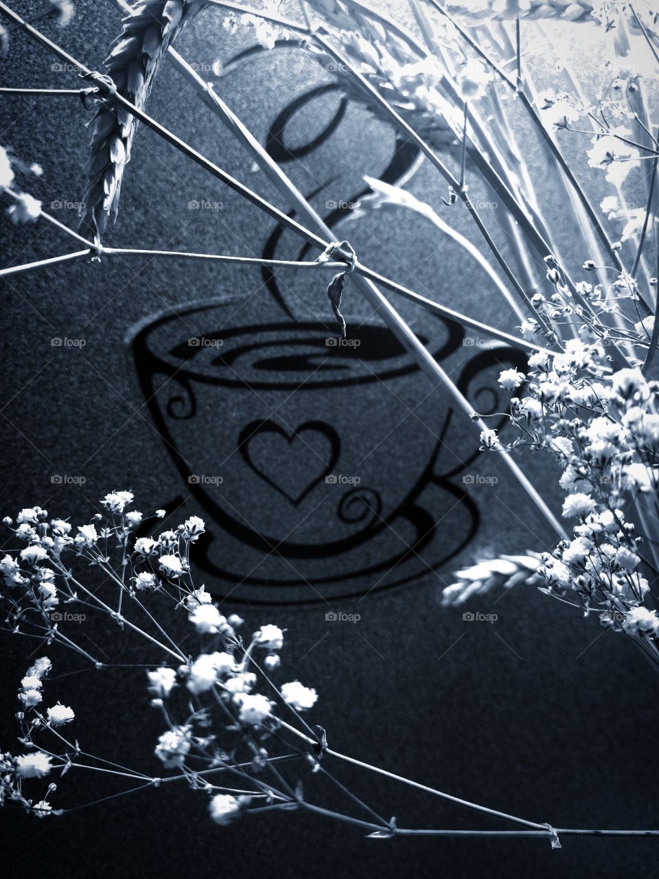 Sticker on the kitchen wall.  A cup of coffee.  In the foreground, ears of wheat and white flowers