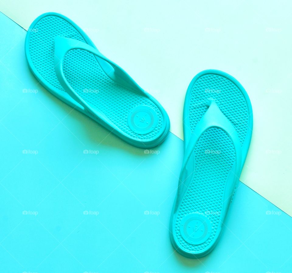 A pop of color. Flip flops on matching background 