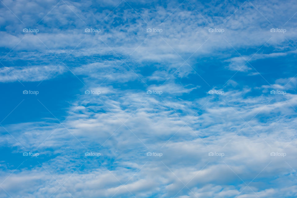 The beauty of the sky with clouds and the sun.