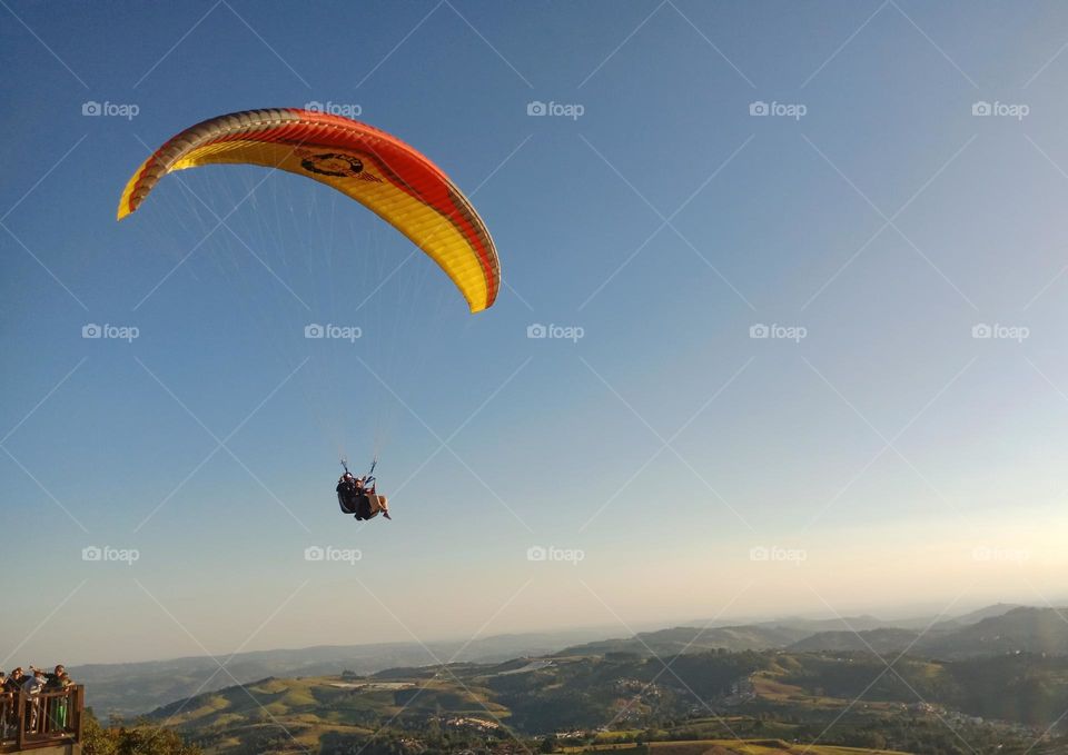 Paragliding over a valley in Alto da Serra,  Serra Negra-SP