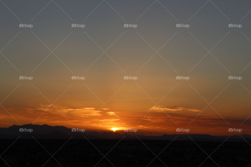 sunrise over desert mountains