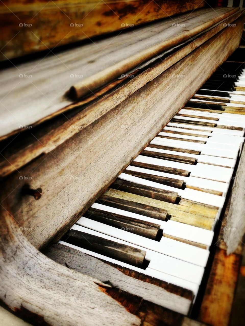 The old piano . An antique store had this sitting in front in Lewiston NY.